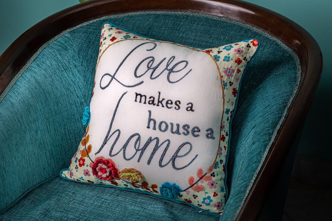 Love makes a house a home cushion