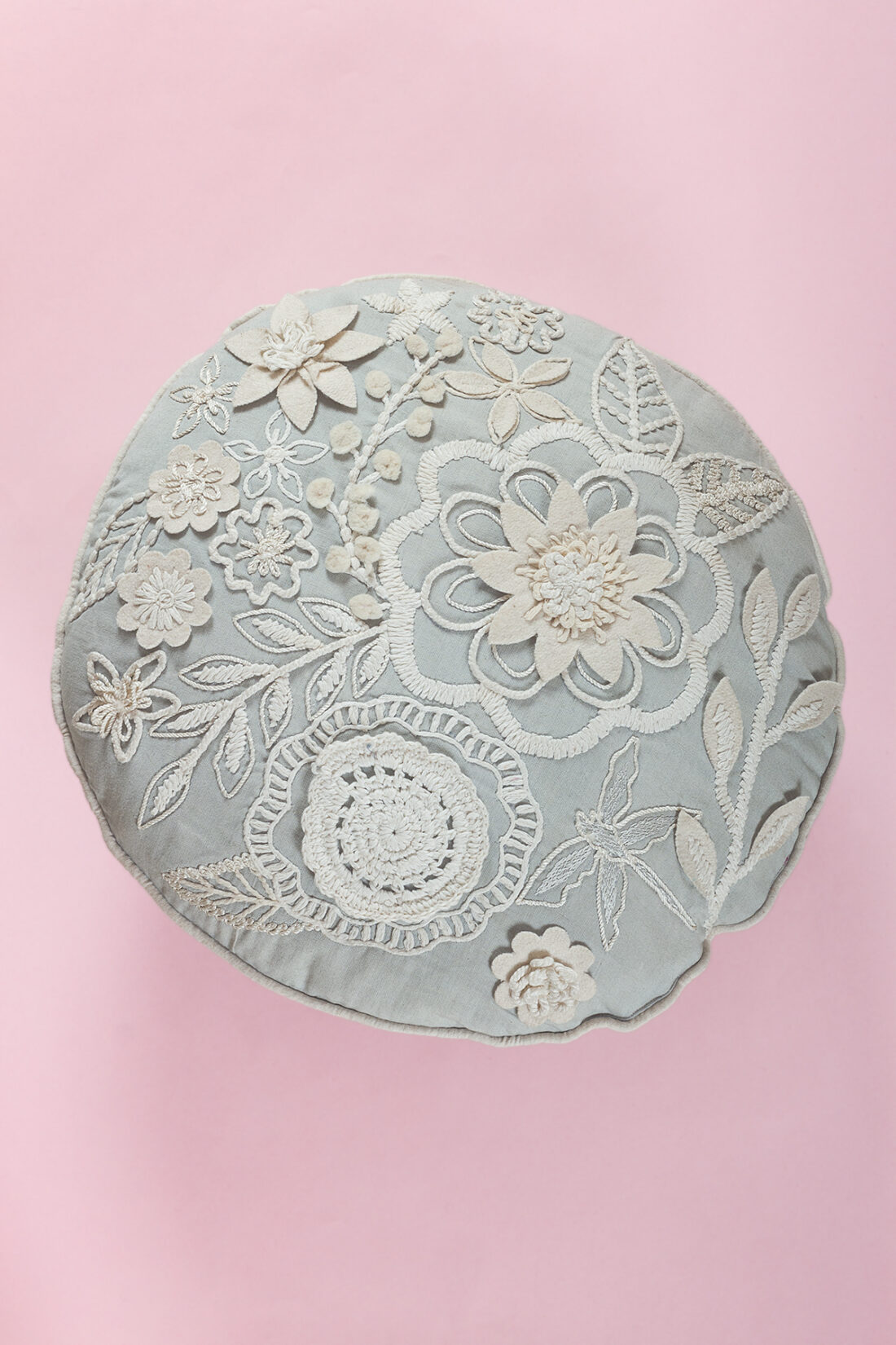 Neutral flowery round cushion
